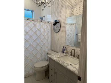 Beautifully renovated and filled with natural light, this bright on Ibis Golf and Country Club in Florida - for sale on GolfHomes.com, golf home, golf lot