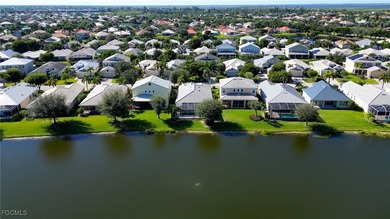 Welcome to this beautifully maintained lakefront home offering on Royal Tee Country Club in Florida - for sale on GolfHomes.com, golf home, golf lot