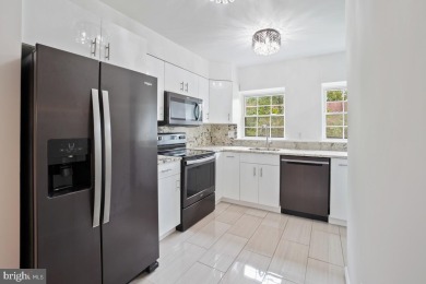 Welcome home to this beautifully renovated townhouse at 2134 on Reston National Golf Course in Virginia - for sale on GolfHomes.com, golf home, golf lot