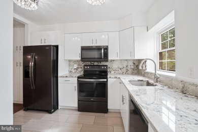 Welcome home to this beautifully renovated townhouse at 2134 on Reston National Golf Course in Virginia - for sale on GolfHomes.com, golf home, golf lot