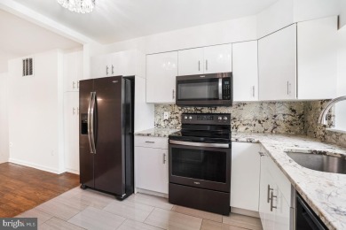 Welcome home to this beautifully renovated townhouse at 2134 on Reston National Golf Course in Virginia - for sale on GolfHomes.com, golf home, golf lot