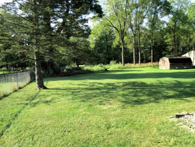 Terrific brick ranch in fantastic location! Private back yard; on Cascades Golf Course in Michigan - for sale on GolfHomes.com, golf home, golf lot