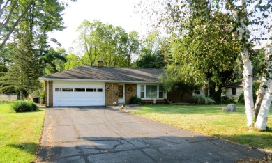 Terrific brick ranch in fantastic location! Private back yard; on Cascades Golf Course in Michigan - for sale on GolfHomes.com, golf home, golf lot