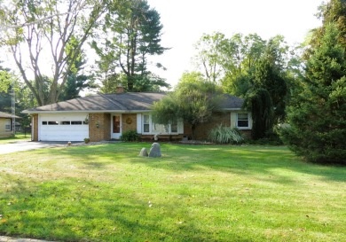 Terrific brick ranch in fantastic location! Private back yard; on Cascades Golf Course in Michigan - for sale on GolfHomes.com, golf home, golf lot