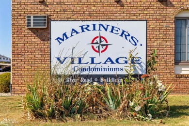 This upper-floor 2-bedroom condo offers beautiful views of the on Marysville Golf Course in Michigan - for sale on GolfHomes.com, golf home, golf lot