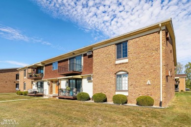 This upper-floor 2-bedroom condo offers beautiful views of the on Marysville Golf Course in Michigan - for sale on GolfHomes.com, golf home, golf lot