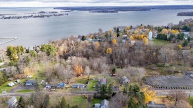 Located just a short walk from the serene waters of Sodus Bay on Sodus Bay Heights Golf Club in New York - for sale on GolfHomes.com, golf home, golf lot