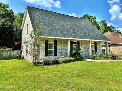 Fantastic home with lots of space located across the street fro on Diamondhead Country Club in Mississippi - for sale on GolfHomes.com, golf home, golf lot