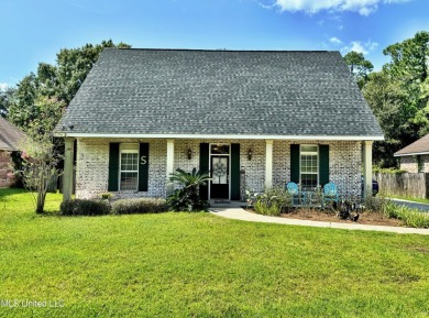 Fantastic home with lots of space located across the street fro on Diamondhead Country Club in Mississippi - for sale on GolfHomes.com, golf home, golf lot