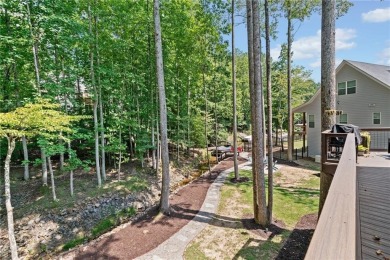 Lake Access and Private Dock! This Charming Lakeside Retreat is on The Highlands Course at Lake Arrowhead in Georgia - for sale on GolfHomes.com, golf home, golf lot