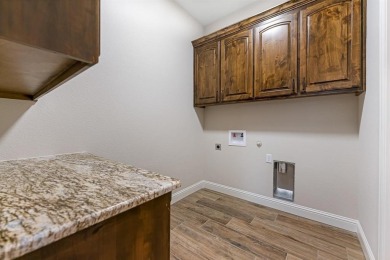 Former model home back on market! This highly energy efficient on Harbor Lakes Golf Club in Texas - for sale on GolfHomes.com, golf home, golf lot
