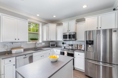 Welcome to this beautifully maintained 4-bedroom, 3.5-bath home on Heritage Golf Club in North Carolina - for sale on GolfHomes.com, golf home, golf lot