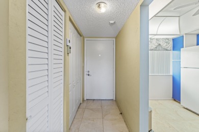 Beautiful & Bright 2-Bedroom, 2-Bath Condo with Serene Canal on Inverrary Country Club in Florida - for sale on GolfHomes.com, golf home, golf lot