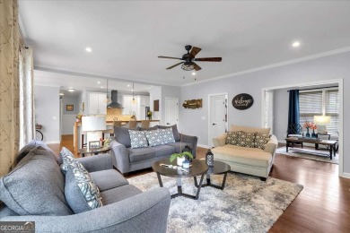 Welcome to this stunning 5 bedroom/4 Bath executive residence on Towne Lake Hills Golf Club in Georgia - for sale on GolfHomes.com, golf home, golf lot