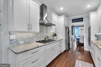 Welcome to this stunning 5 bedroom/4 Bath executive residence on Towne Lake Hills Golf Club in Georgia - for sale on GolfHomes.com, golf home, golf lot