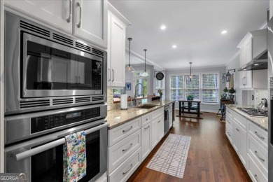 Welcome to this stunning 5 bedroom/4 Bath executive residence on Towne Lake Hills Golf Club in Georgia - for sale on GolfHomes.com, golf home, golf lot