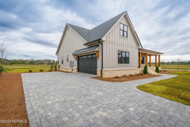 Nestled on a corner lot with water views, among the 634-acre on Cutter Creek Golf Club in North Carolina - for sale on GolfHomes.com, golf home, golf lot