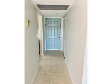 This beautifully remodeled corner unit offers serene views of on Boca Dunes Golf and Country Club in Florida - for sale on GolfHomes.com, golf home, golf lot