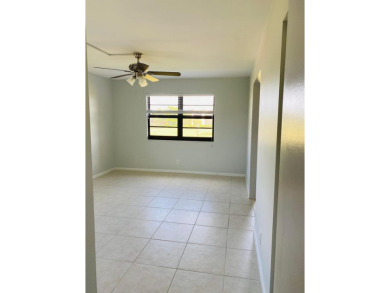 This beautifully remodeled corner unit offers serene views of on Boca Dunes Golf and Country Club in Florida - for sale on GolfHomes.com, golf home, golf lot