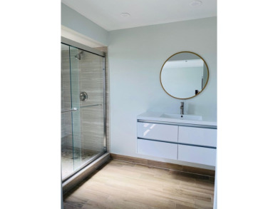 This beautifully remodeled corner unit offers serene views of on Boca Dunes Golf and Country Club in Florida - for sale on GolfHomes.com, golf home, golf lot