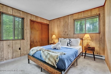 Welcome to your ideal Pocono escape in the heart of Lake Naomi on Lake Naomi Timber Trails Golf Club in Pennsylvania - for sale on GolfHomes.com, golf home, golf lot