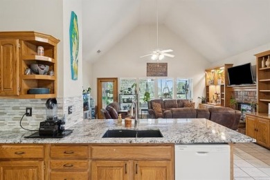 Enjoy the sunset from the back patio overlooking the 18th hole on Battle Creek Golf Course in Oklahoma - for sale on GolfHomes.com, golf home, golf lot