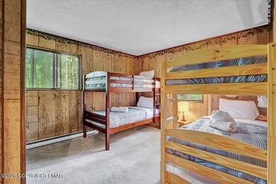 Welcome to your ideal Pocono escape in the heart of Lake Naomi on Lake Naomi Timber Trails Golf Club in Pennsylvania - for sale on GolfHomes.com, golf home, golf lot