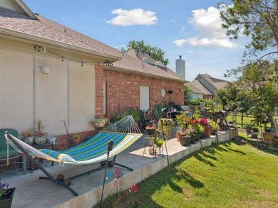 Enjoy the sunset from the back patio overlooking the 18th hole on Battle Creek Golf Course in Oklahoma - for sale on GolfHomes.com, golf home, golf lot