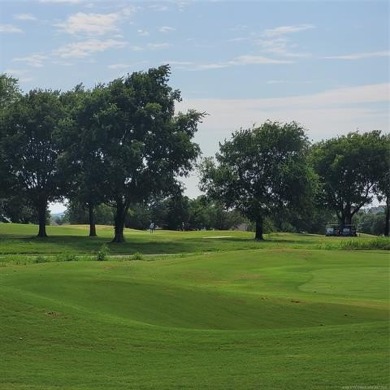 Enjoy the sunset from the back patio overlooking the 18th hole on Battle Creek Golf Course in Oklahoma - for sale on GolfHomes.com, golf home, golf lot