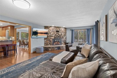 Welcome home to this stunning 5-bedroom, 4-bathroom residence - on Elk River Golf Club in Minnesota - for sale on GolfHomes.com, golf home, golf lot