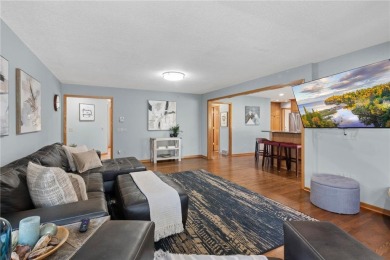 Welcome home to this stunning 5-bedroom, 4-bathroom residence - on Elk River Golf Club in Minnesota - for sale on GolfHomes.com, golf home, golf lot