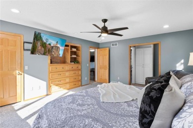 Welcome home to this stunning 5-bedroom, 4-bathroom residence - on Elk River Golf Club in Minnesota - for sale on GolfHomes.com, golf home, golf lot