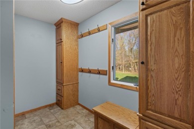 Welcome home to this stunning 5-bedroom, 4-bathroom residence - on Elk River Golf Club in Minnesota - for sale on GolfHomes.com, golf home, golf lot