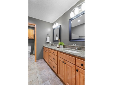 Welcome home to this stunning 5-bedroom, 4-bathroom residence - on Elk River Golf Club in Minnesota - for sale on GolfHomes.com, golf home, golf lot