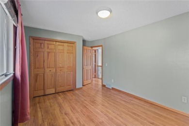 Welcome home to this stunning 5-bedroom, 4-bathroom residence - on Elk River Golf Club in Minnesota - for sale on GolfHomes.com, golf home, golf lot