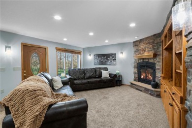Welcome home to this stunning 5-bedroom, 4-bathroom residence - on Elk River Golf Club in Minnesota - for sale on GolfHomes.com, golf home, golf lot