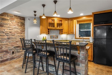 Welcome home to this stunning 5-bedroom, 4-bathroom residence - on Elk River Golf Club in Minnesota - for sale on GolfHomes.com, golf home, golf lot