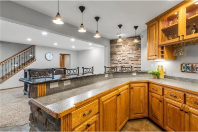 Welcome home to this stunning 5-bedroom, 4-bathroom residence - on Elk River Golf Club in Minnesota - for sale on GolfHomes.com, golf home, golf lot