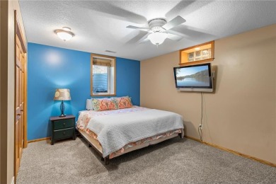 Welcome home to this stunning 5-bedroom, 4-bathroom residence - on Elk River Golf Club in Minnesota - for sale on GolfHomes.com, golf home, golf lot