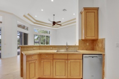 SPECTACULAR GOLF & WATER VIEWS! Nestled within the prestigious on The Legacy Golf and Tennis Club in Florida - for sale on GolfHomes.com, golf home, golf lot