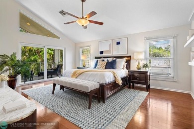 Serene lake views, sunlit living spaces, and a private backyard on Delaire Golf and Country Club in Florida - for sale on GolfHomes.com, golf home, golf lot