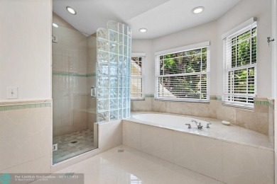 Serene lake views, sunlit living spaces, and a private backyard on Delaire Golf and Country Club in Florida - for sale on GolfHomes.com, golf home, golf lot