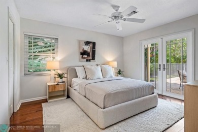 Serene lake views, sunlit living spaces, and a private backyard on Delaire Golf and Country Club in Florida - for sale on GolfHomes.com, golf home, golf lot
