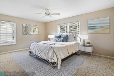 Serene lake views, sunlit living spaces, and a private backyard on Delaire Golf and Country Club in Florida - for sale on GolfHomes.com, golf home, golf lot