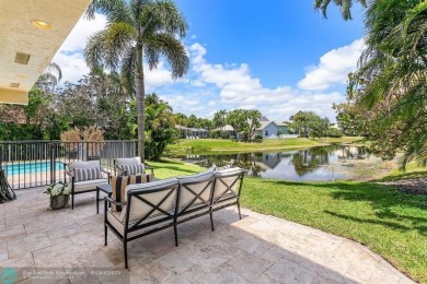 Serene lake views, sunlit living spaces, and a private backyard on Delaire Golf and Country Club in Florida - for sale on GolfHomes.com, golf home, golf lot