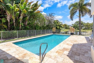 Serene lake views, sunlit living spaces, and a private backyard on Delaire Golf and Country Club in Florida - for sale on GolfHomes.com, golf home, golf lot