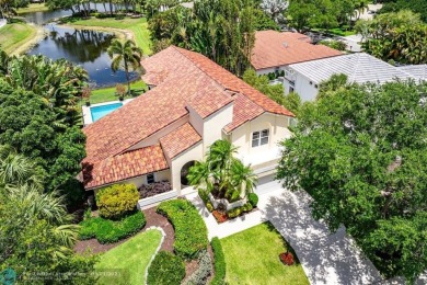 Serene lake views, sunlit living spaces, and a private backyard on Delaire Golf and Country Club in Florida - for sale on GolfHomes.com, golf home, golf lot