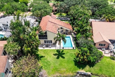 Serene lake views, sunlit living spaces, and a private backyard on Delaire Golf and Country Club in Florida - for sale on GolfHomes.com, golf home, golf lot