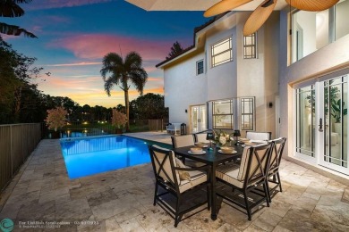 Serene lake views, sunlit living spaces, and a private backyard on Delaire Golf and Country Club in Florida - for sale on GolfHomes.com, golf home, golf lot