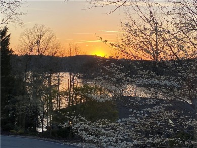 Newly renovated with stunning seasonal lake and sunset views on Keowee Key Golf and Country Club in South Carolina - for sale on GolfHomes.com, golf home, golf lot